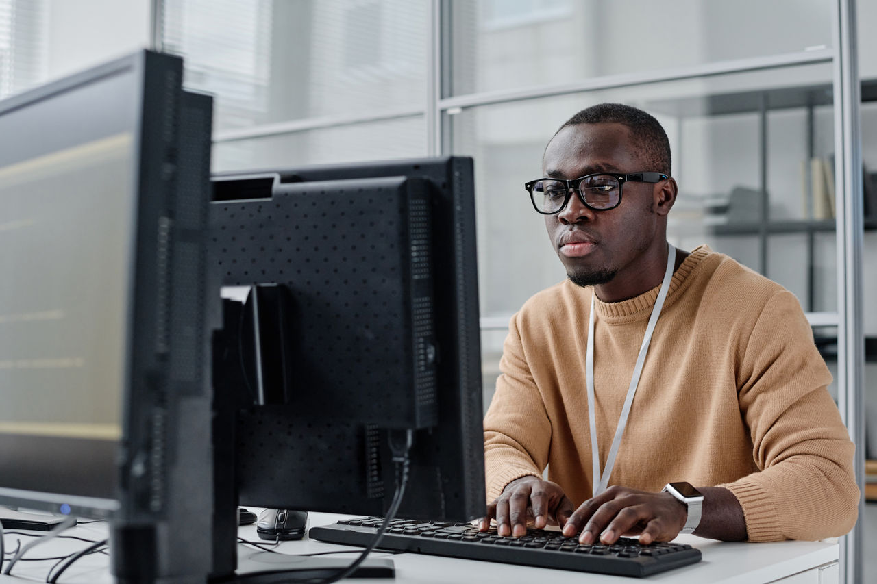 Programmer concentrating on his computer